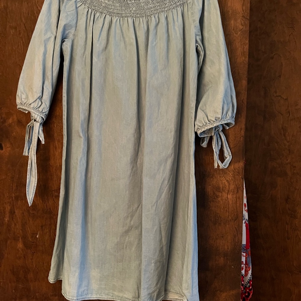 Denim dress. On or off shoulder. Never worn. Tags on